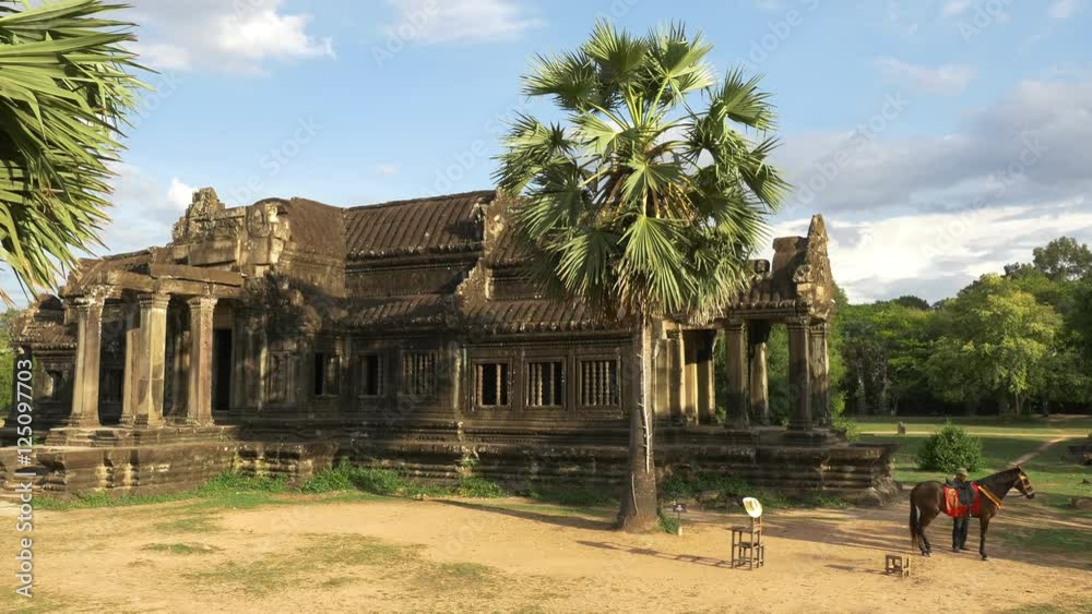 Man with Horse Ancient Temple Ruins - Angkor Wat Temple Man with Horse Ancient Temple Ruins - Angkor Wat Temple