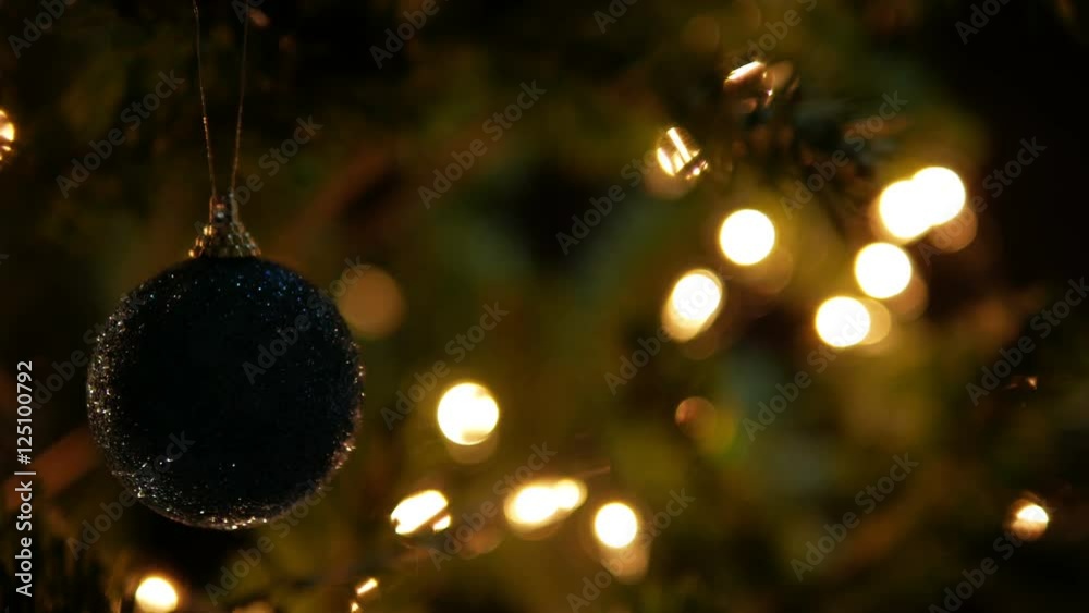 Christmas ball on tree with bokeh background in Christmas day. Christmas ball on tree with bokeh background in Christmas day.