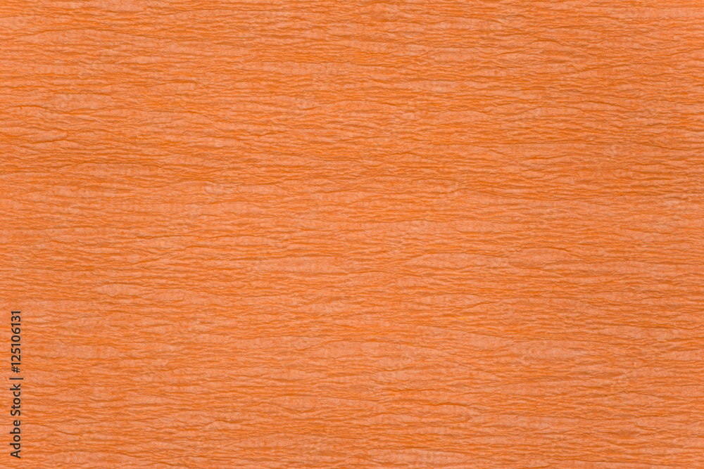 Fototapeta premium Brightly orange crumpled paper texture