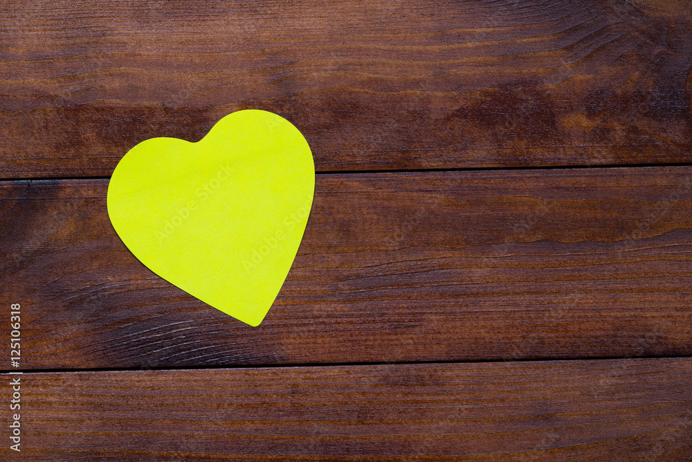 yellow heart shaped mock up frame on stylish wooden background yellow heart shaped mock up frame on stylish wooden background