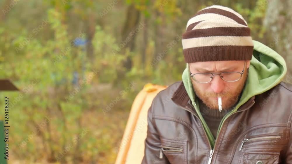 Man lights a cigarette lighter in slow motion Man lights a cigarette lighter in slow motion