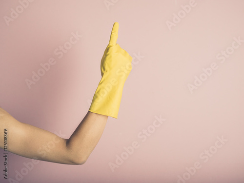 Hand in rubber glove pointing up