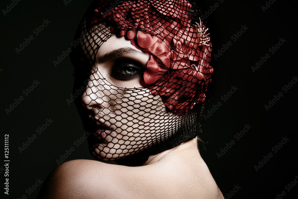 Fashion portrait of a beautiful woman in a black veil on her face ...