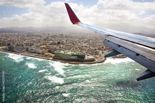 Jeju island and Jeju-si town view from an airplane illuminator