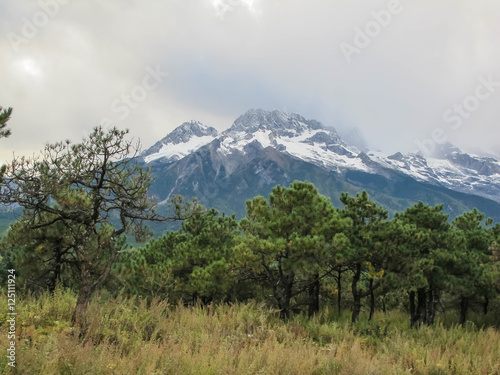 View of Jade Dragon Snow Mountain. Jade Dragon Snow Mountain is a mountain near Lijiang  in Yunnan province  southwestern China