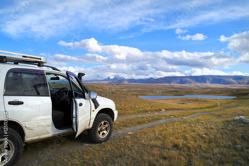 Off-road tourists car on famous mountain Plateau Ukok, Altai, Ru