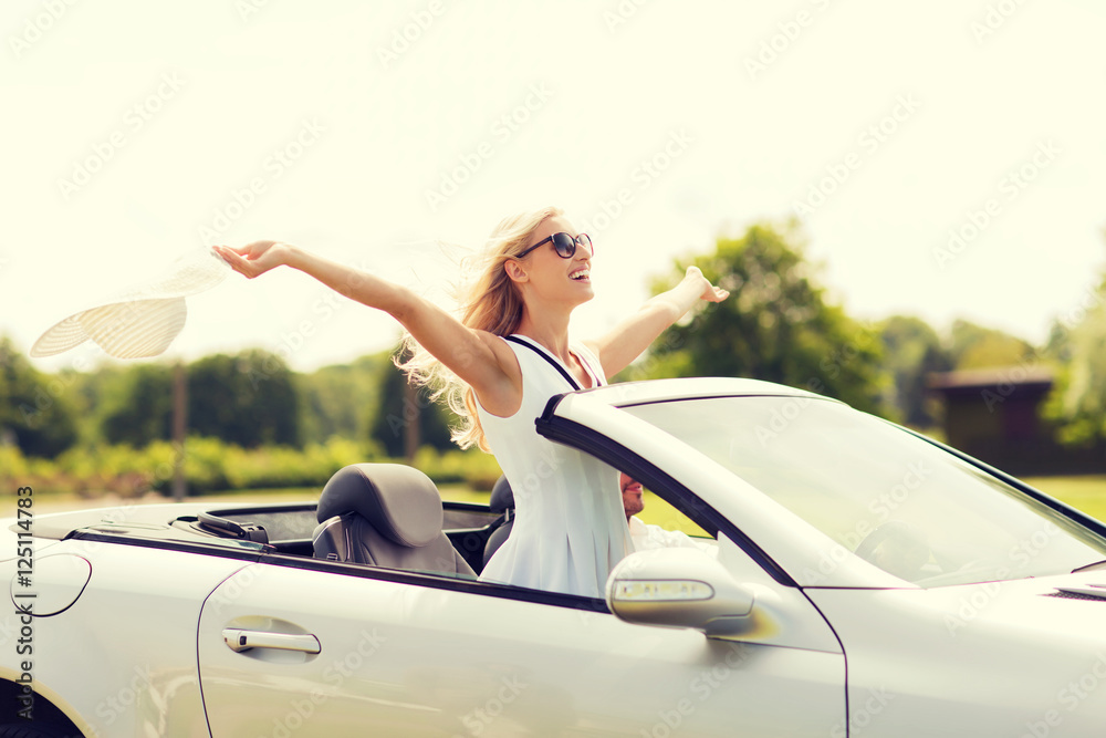 happy man and woman driving in cabriolet car - obrazy, fototapety, plakaty 