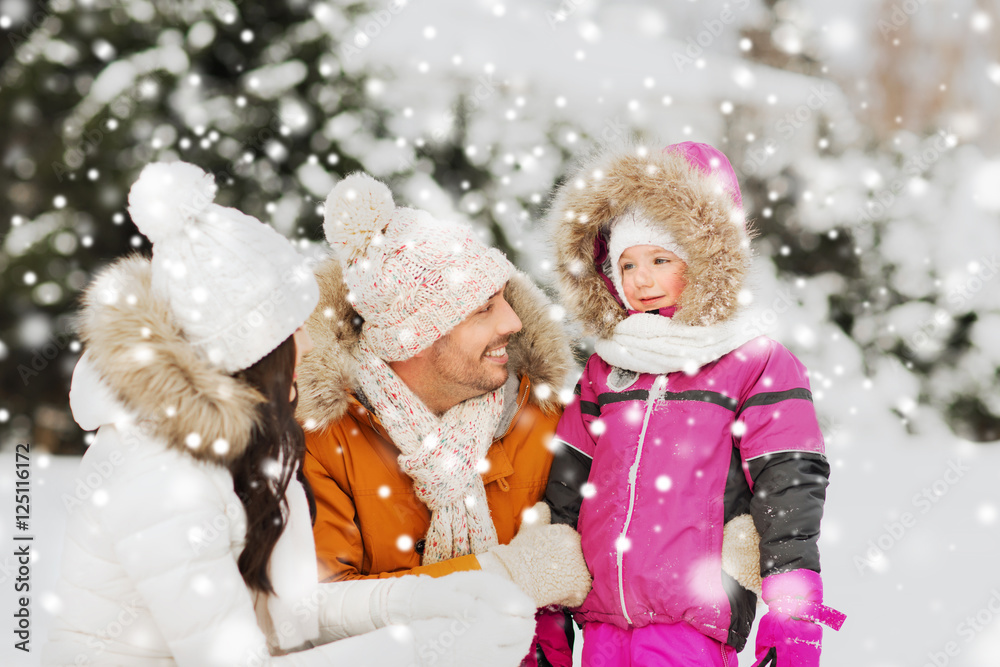 happy family with child in winter clothes outdoors happy family with child in winter clothes outdoors
