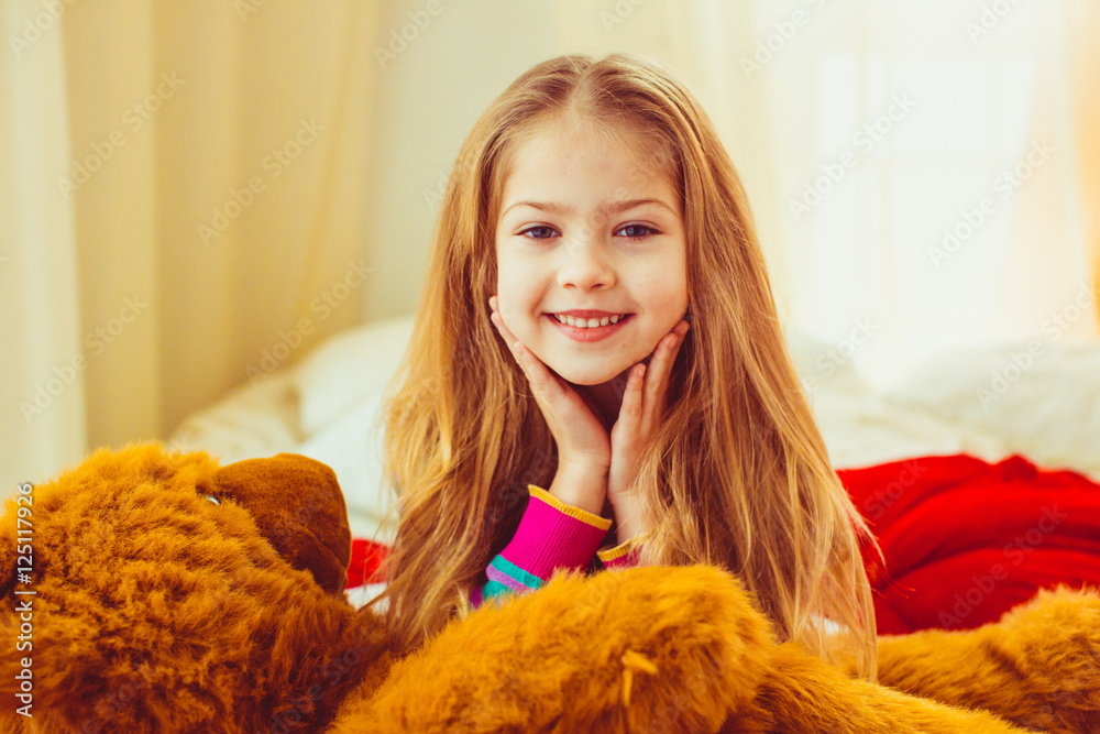 Pretty face of a little girl surrounded with her blonde hair Pretty face of a little girl surrounded with her blonde hair