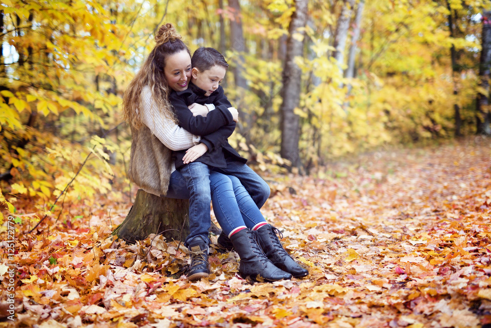 Mother with son in forest in autumn Mother with son in forest in autumn