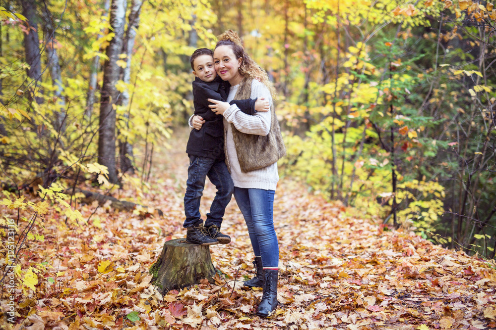 Mother with son in forest in autumn Mother with son in forest in autumn