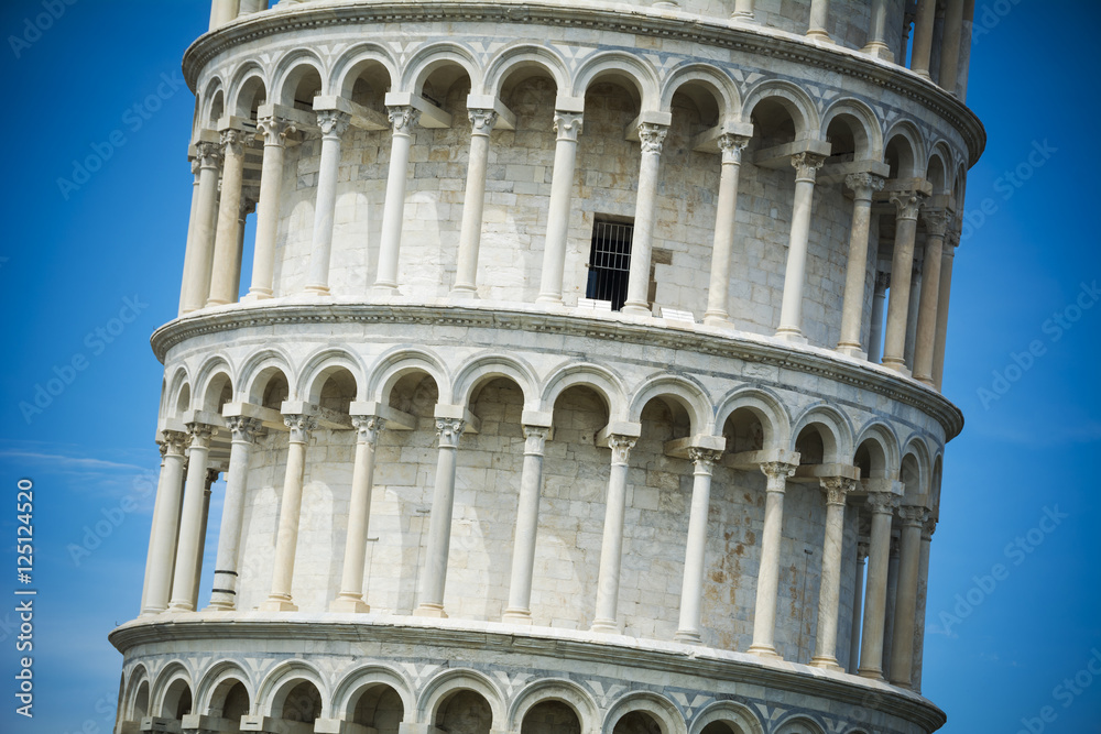 Detail on the Leaning Tower of Pisa in bright sunlight