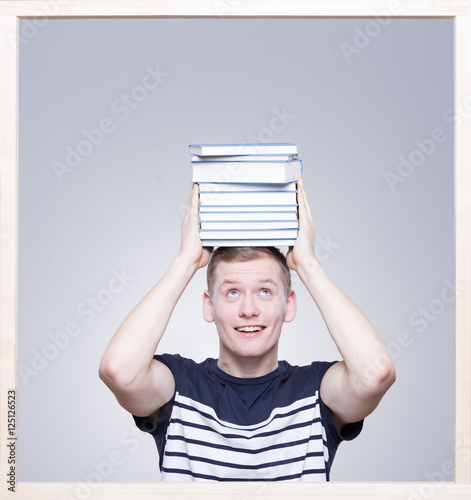 Student keeping books on his head