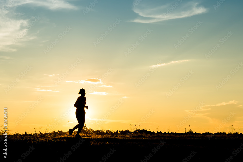 silhouette of female relax on beautiful sunset background