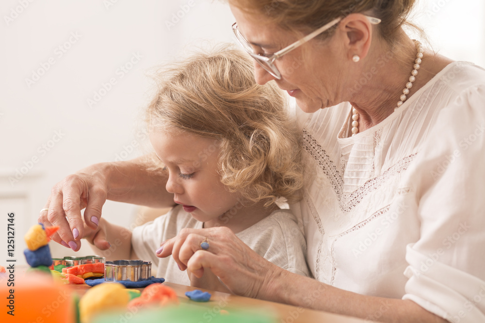 Manny helping to make a  toy