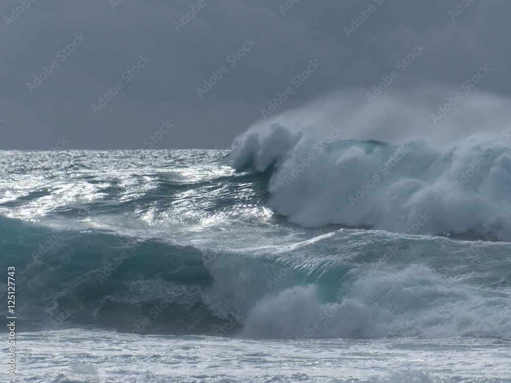 Massive surf at the Atlantic sea rolling in to the beach. Massive surf at the Atlantic sea rolling in to the beach.