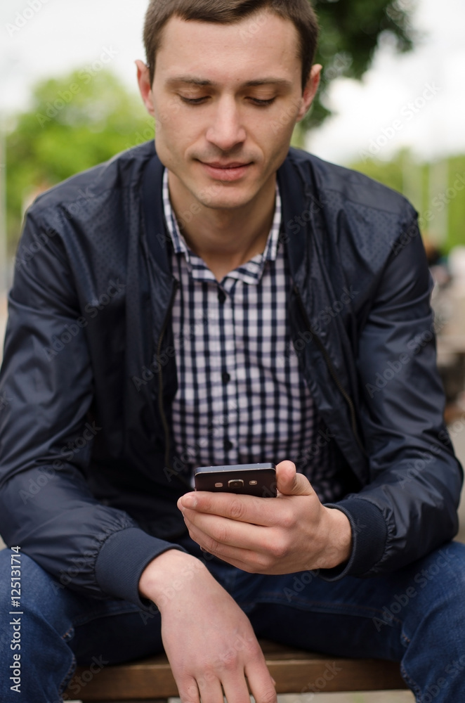 Young man using his phone Young man using his phone