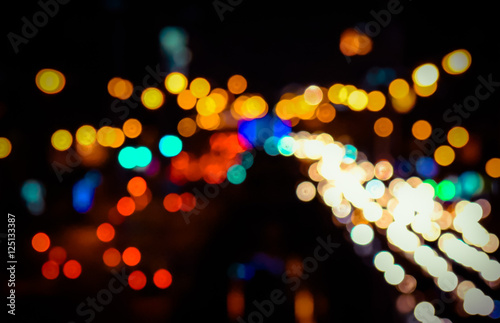 Abstract blur bokeh of Evening traffic jam on road in city. Vintage tone