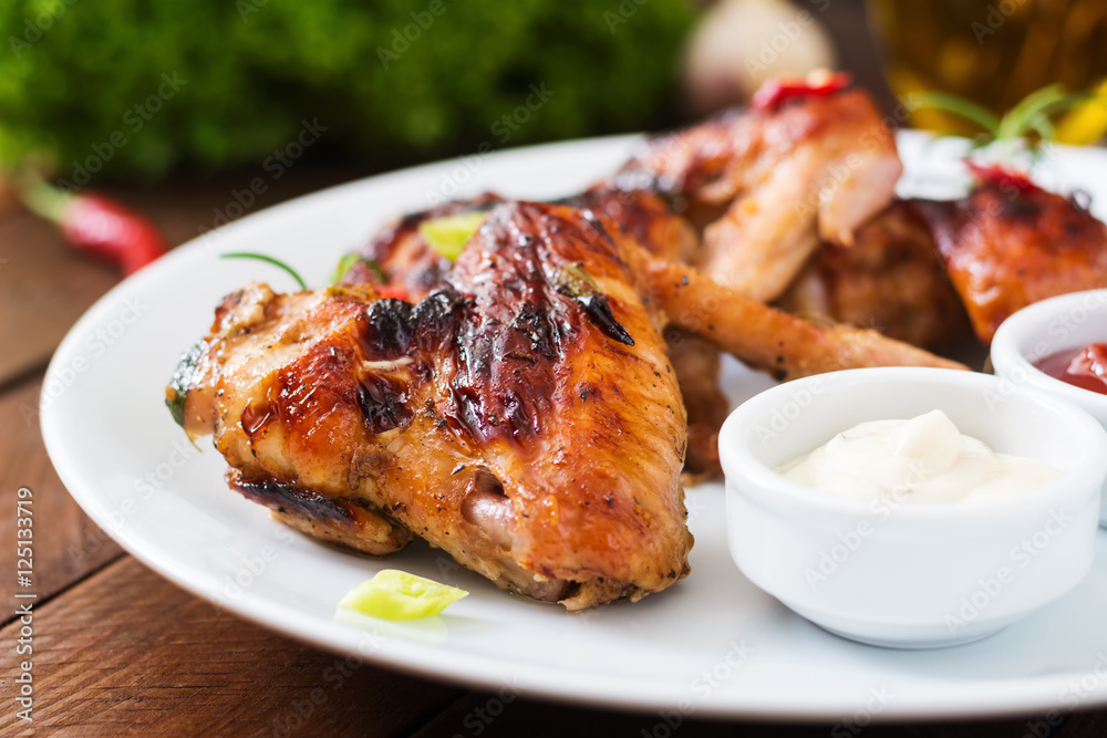 Baked chicken wings in the Asian style on plate. Baked chicken wings in the Asian style on plate.