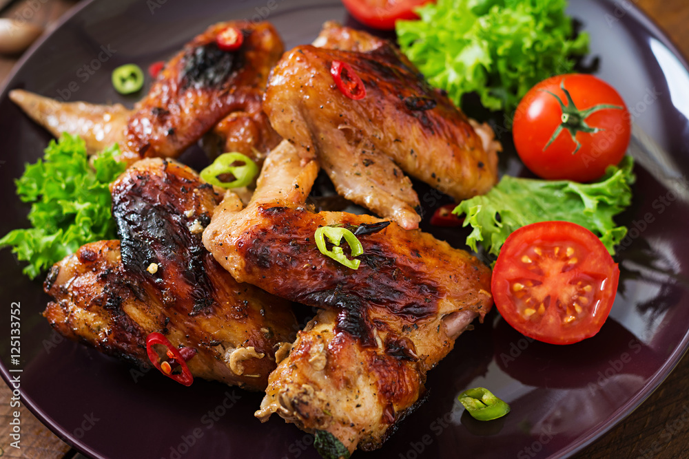 Baked chicken wings in the Asian style on plate. Baked chicken wings in the Asian style on plate.