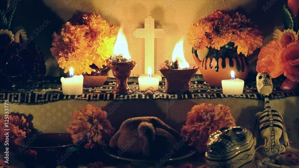 Day of the dead altar with cempasuchil flowers, burning copal and candles.