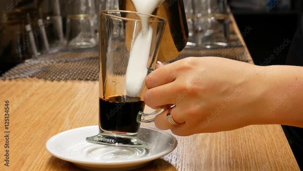 4K Woman preparing coffee latte.