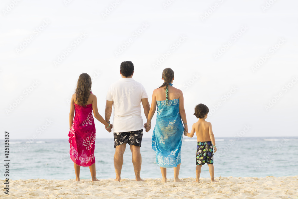 Lovely Family Enjoying at the beach Lovely Family Enjoying at the beach