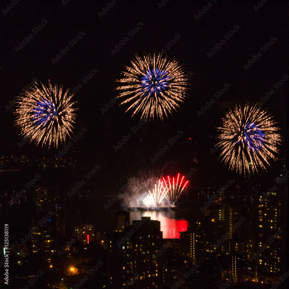 Fireworks over beautiful night city view in Vancouver, Canada. Fireworks over beautiful night city view in Vancouver, Canada.