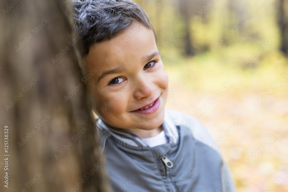 Six years old child autumn season in a park Six years old child autumn season in a park