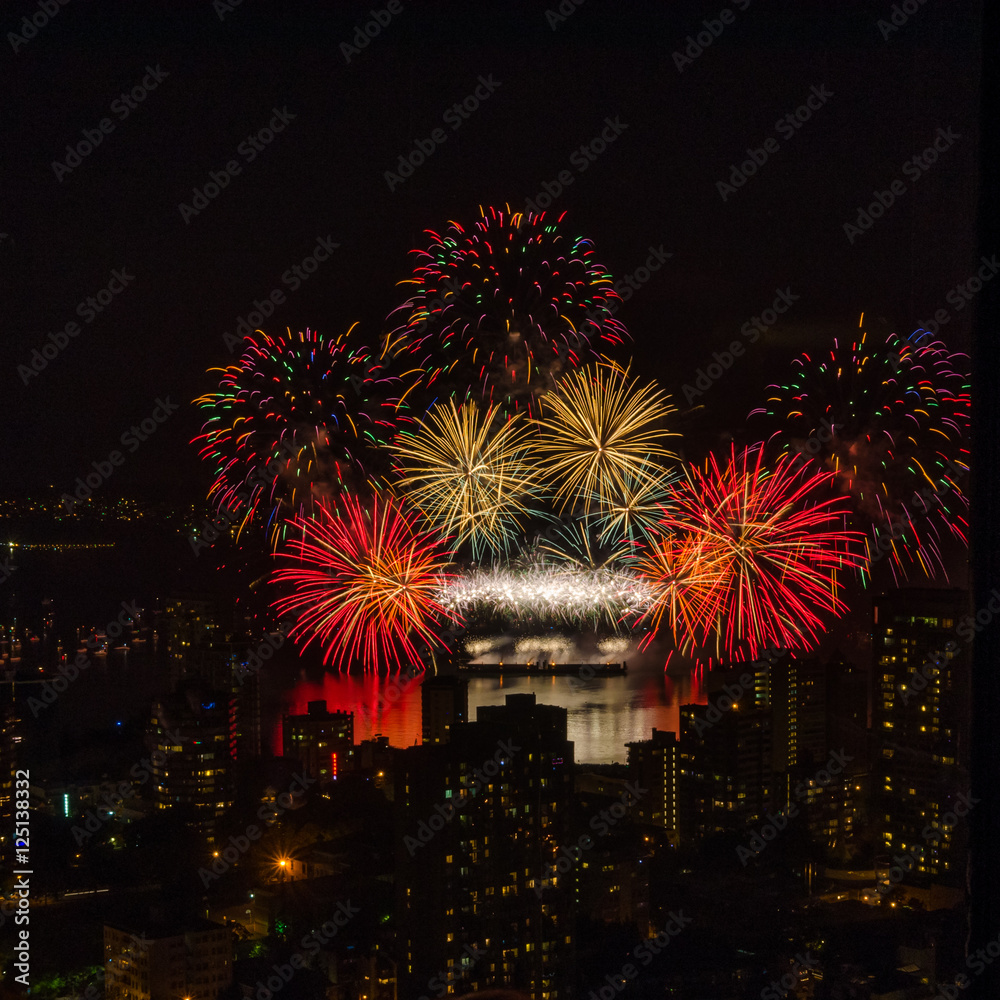 Fireworks over beautiful night city view in Vancouver, Canada. Fireworks over beautiful night city view in Vancouver, Canada.