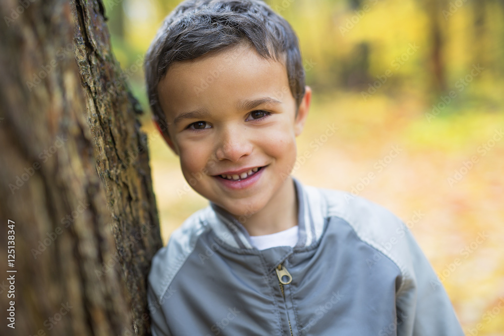 Six years old child autumn season in a park Six years old child autumn season in a park