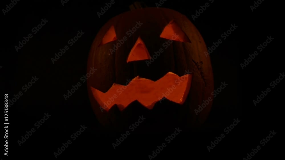 illuminated halloween pumpkin zooming in illuminated halloween pumpkin zooming in