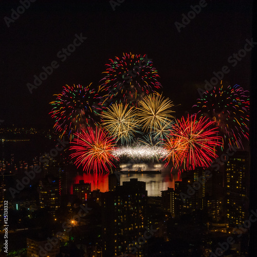 Fireworks over beautiful night city view in Vancouver, Canada. © karamysh