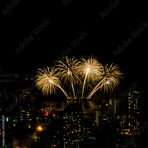 Fireworks over beautiful night city view in Vancouver, Canada.