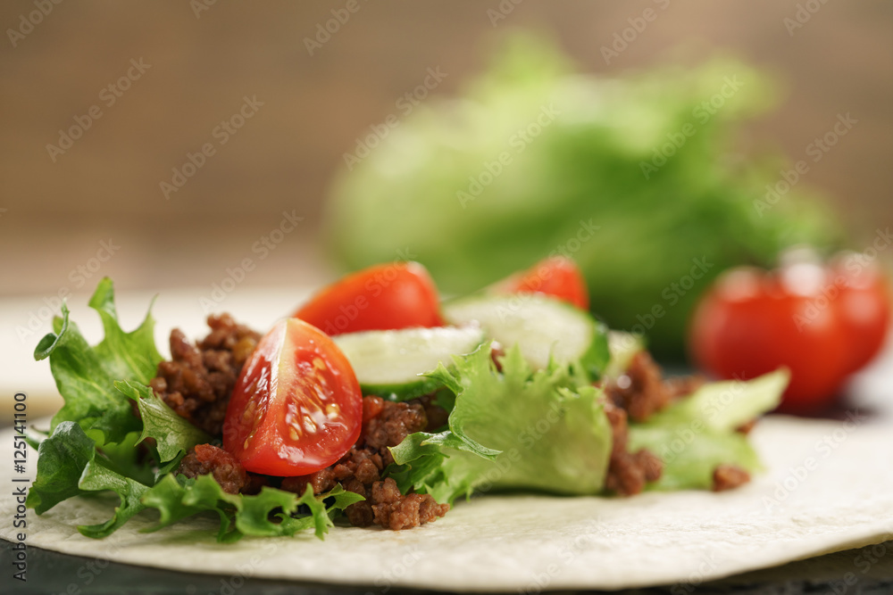 open tortilla with beef, frillice and vegetables open tortilla with beef, frillice and vegetables