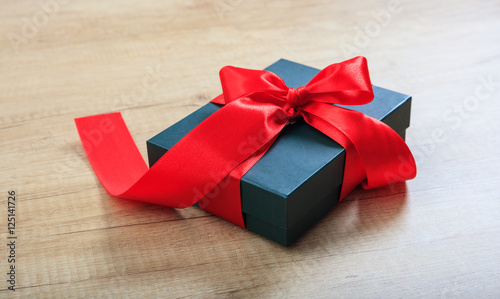 Gift box on wooden background