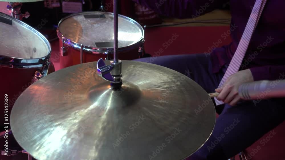 Man playing the drums on stage