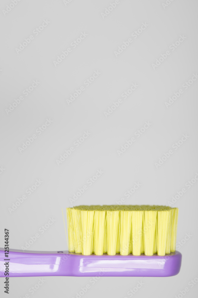 colorful toothbrush isolated on white background, lying position colorful toothbrush isolated on white background, lying position