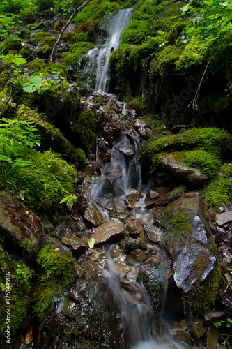 beautiful view of a waterfall in the mountains