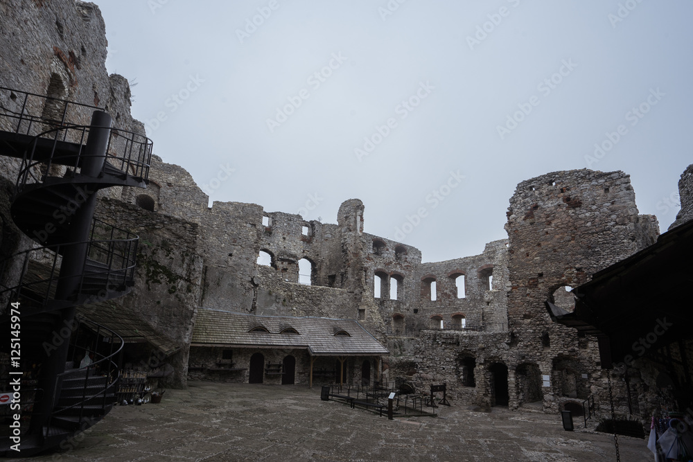 courtyard of medieval castle ruin in bad weather