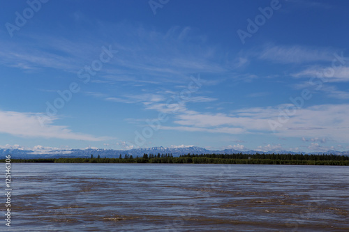 Horizon line between the river and the sky. Indigirka River. Yakutia. Russia. photo