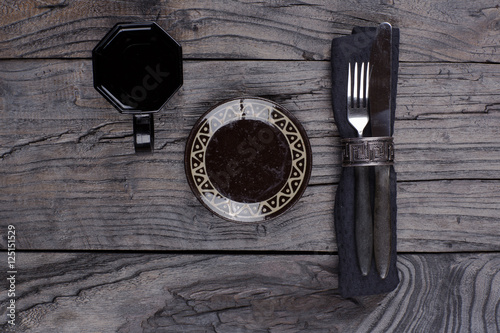 cutlery on a black wooden table