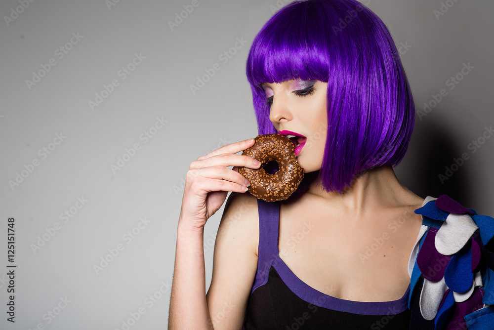 beautiful girl with purple hair. a girl holding a donut beautiful girl with purple hair. a girl holding a donut