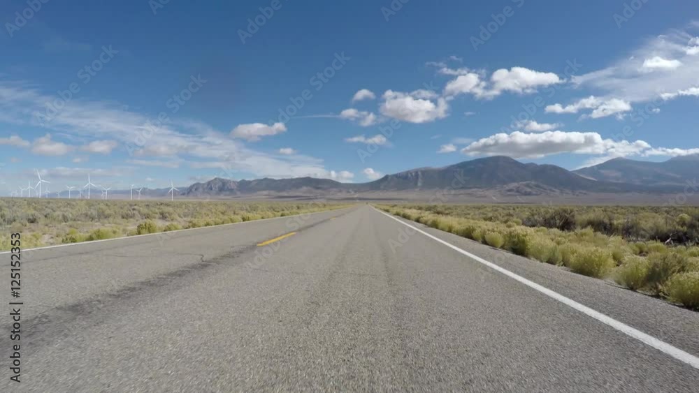 Driving past windmills on Highway 50 near Great Basin National Park in Northern Nevada. Driving past windmills on Highway 50 near Great Basin National Park in Northern Nevada.