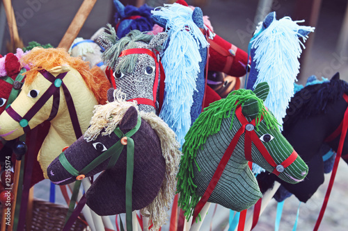 Fotografie Handmade colorful rocking horses on sale