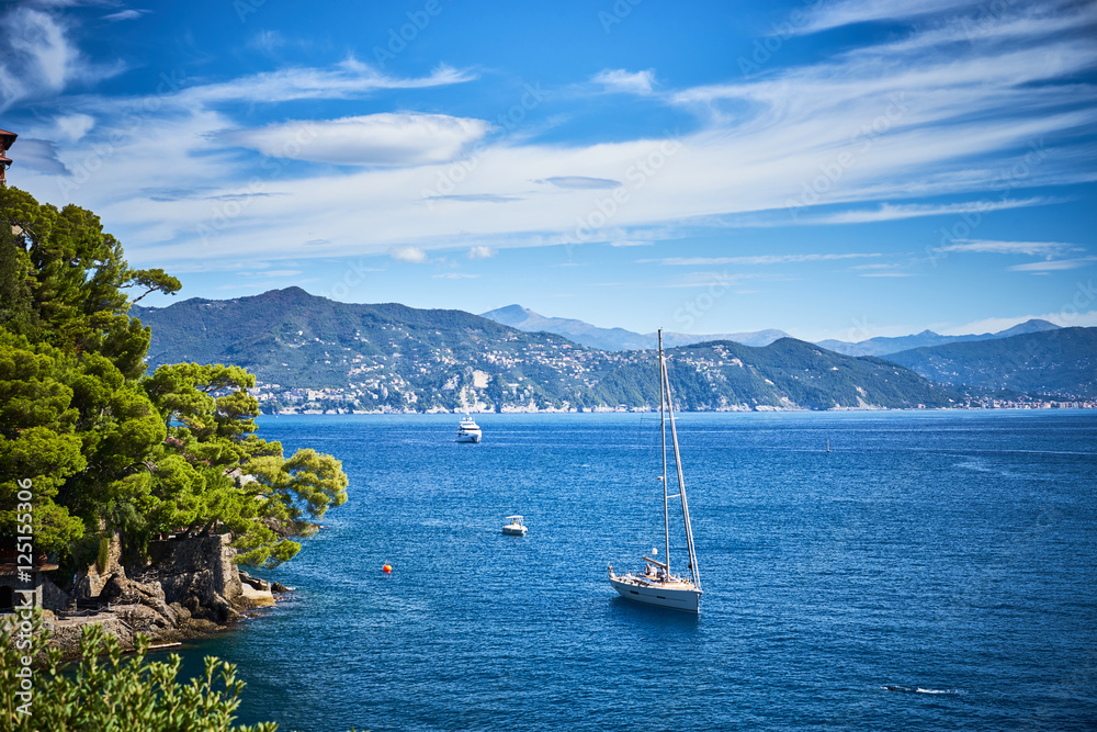sailing ships and relaxed people at mediterranean sea / Vacation in Italy