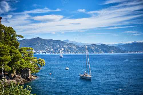 sailing ships and relaxed people at mediterranean sea / Vacation in Italy photo