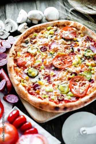 Pizza and ingredients with low depth of field