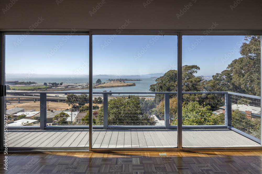 Large clean glass sliding doors with bay view.