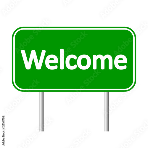 Welcome green road sign.